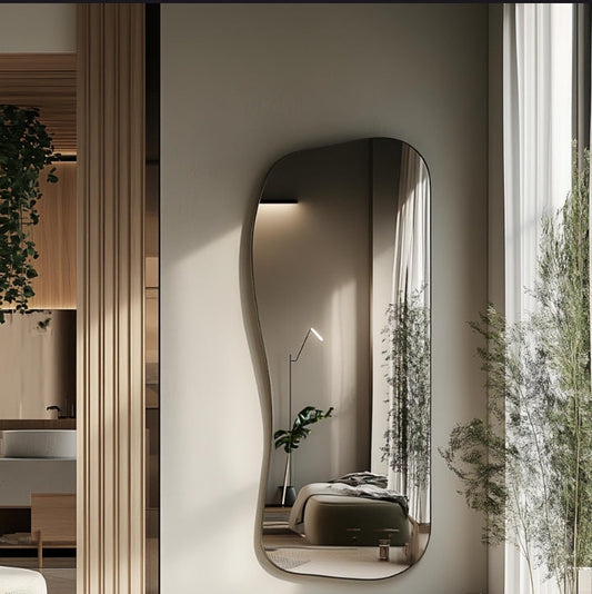 Full-length asymmetrical wall mirror with a sleek thin gold frame
