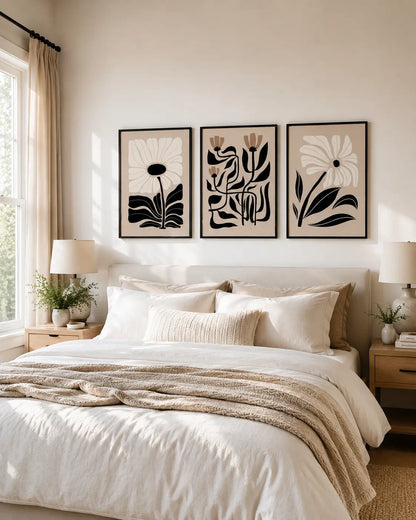 3 piece framed wall art set with botanical artwork above a bedroom