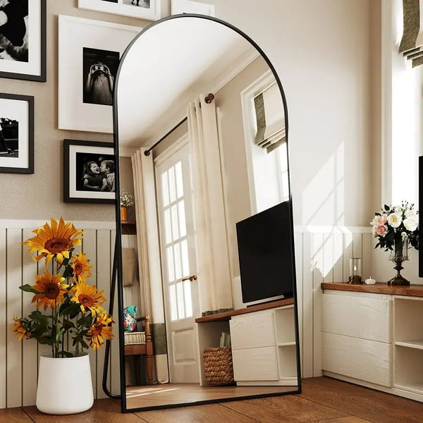 Arched_standing_mirror_with_sleek_frame_for_modern_bedroom_and_living_room