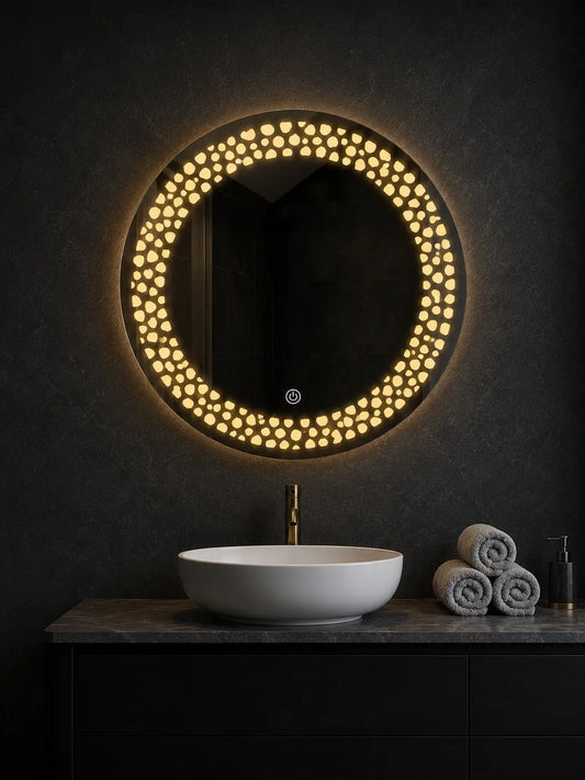 round mirror with lights mounted above bathroom vanity with decorative led pattern