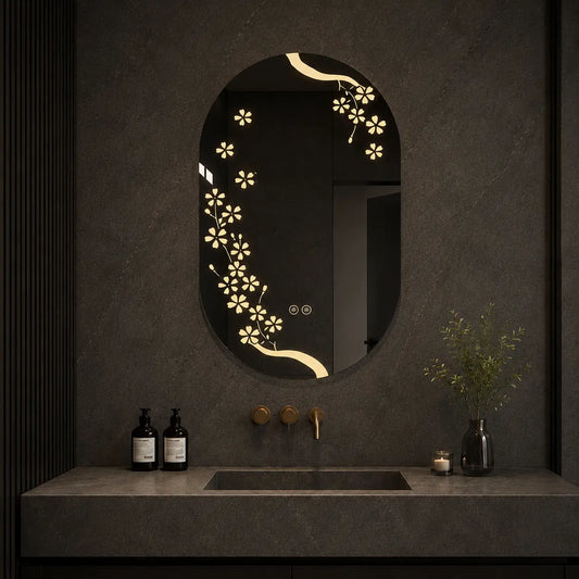 Bathroom mirror with floral design and lighting on a textured wall.