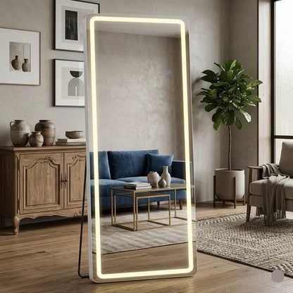 Large illuminated floor mirror in a living room setting with furniture and decor.