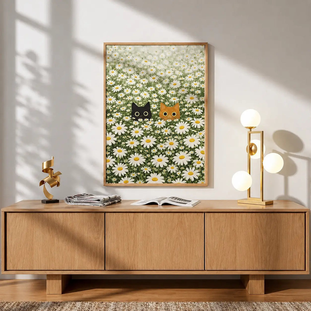 Cat wall art featuring two playful cat illustrations surrounded by white daisies and green foliage in a natural wooden frame.