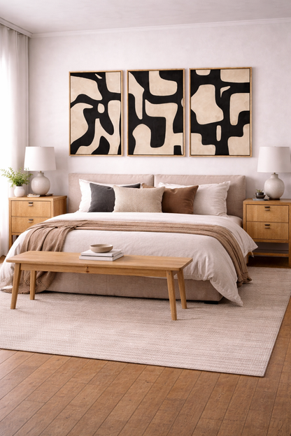 frames on wall with bold abstract bedroom panels above bed wall
