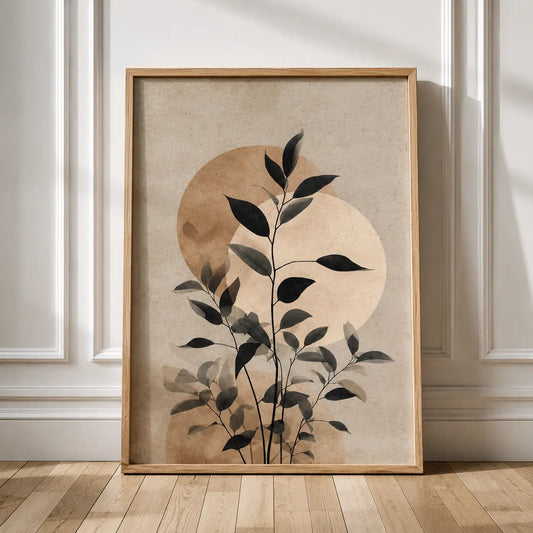 Minimal leaf wall art featuring delicate dark botanical branches over warm neutral tones, framed for elegant modern interior styling.