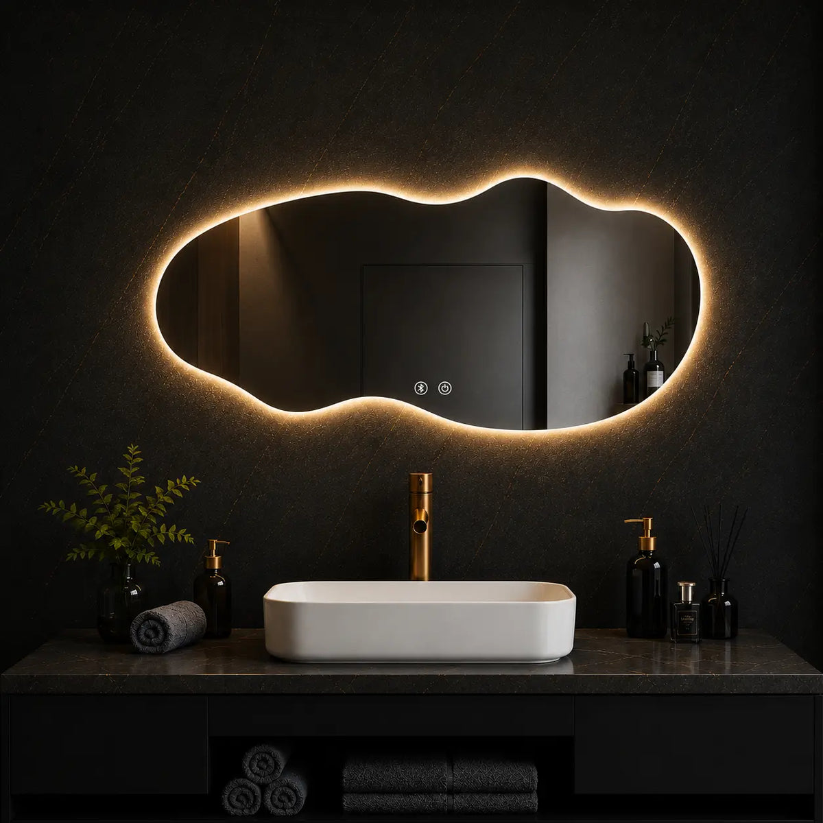 Modern abstract irregular mirror with LED lighting installed above a luxury bathroom vanity in a contemporary interior.