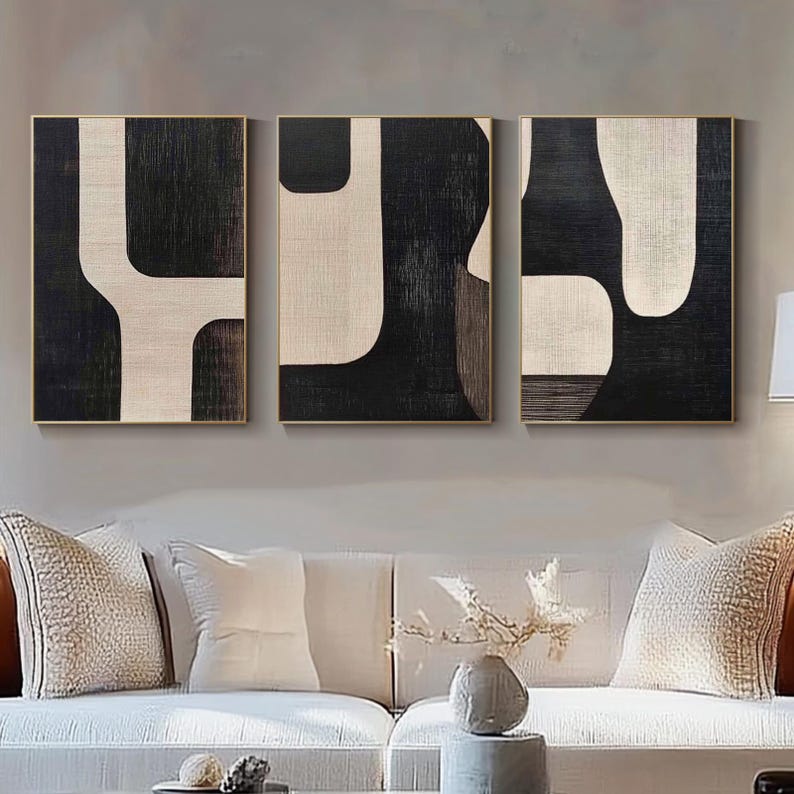 premium wall panels with bold abstract framed artwork above sofa wall