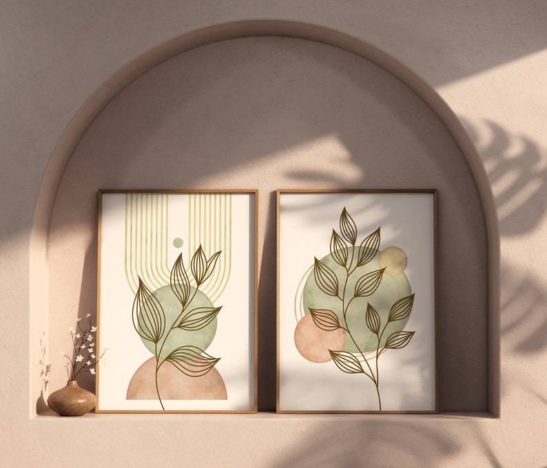 set of two botanical wall frames with leaf artwork in warm neutral interior