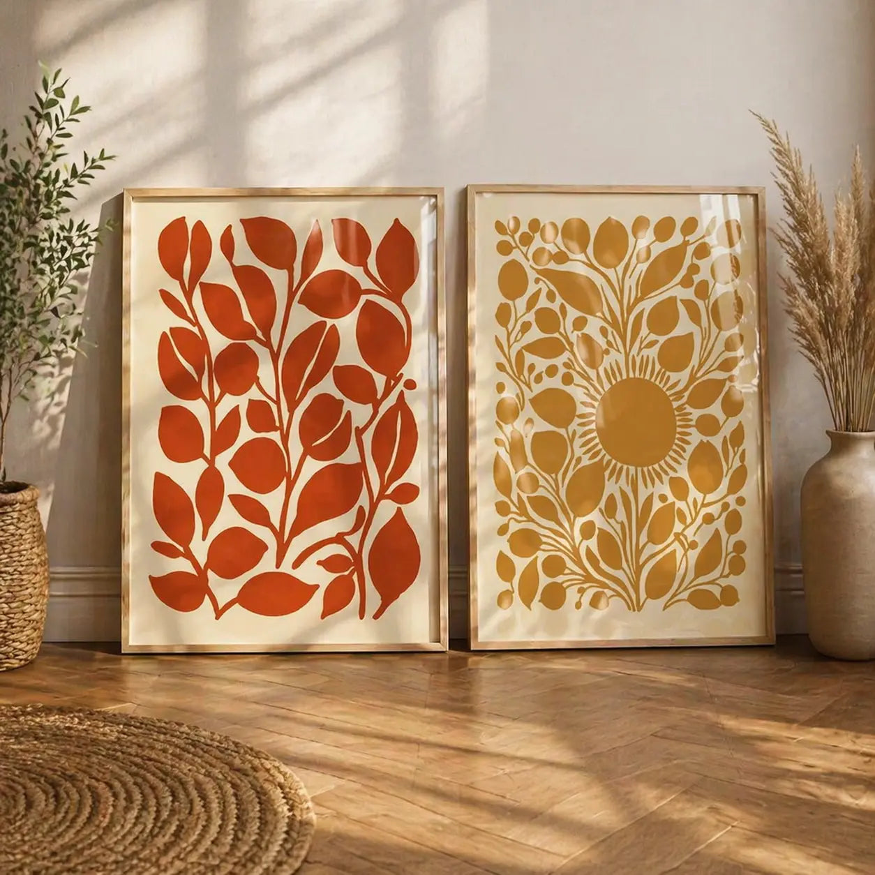 Wall art for living room featuring a set of 2 warm terracotta and golden botanical prints in wooden frames by Decorsz Pakistan
